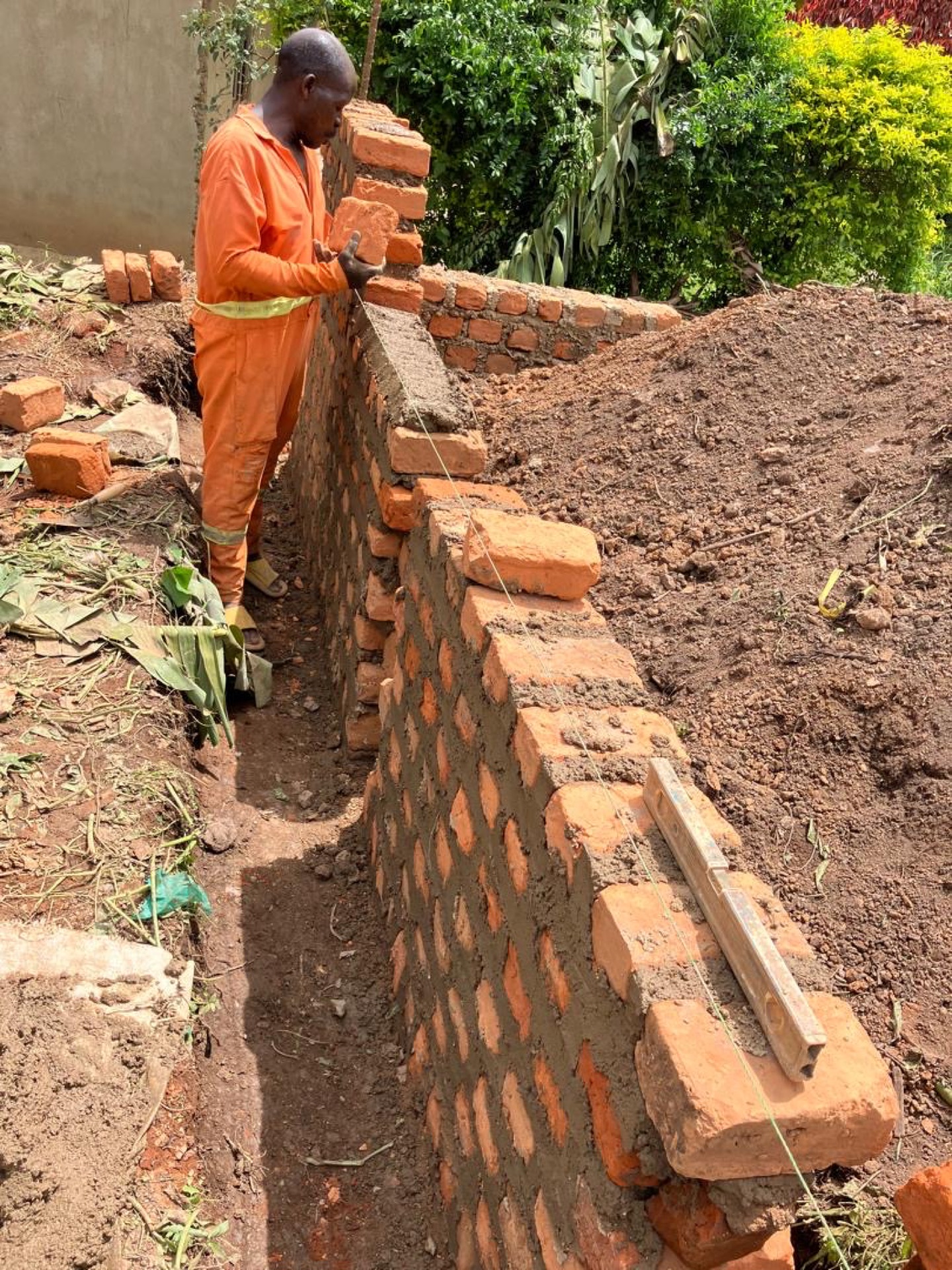 Worker laying bricks for HopeKitchen