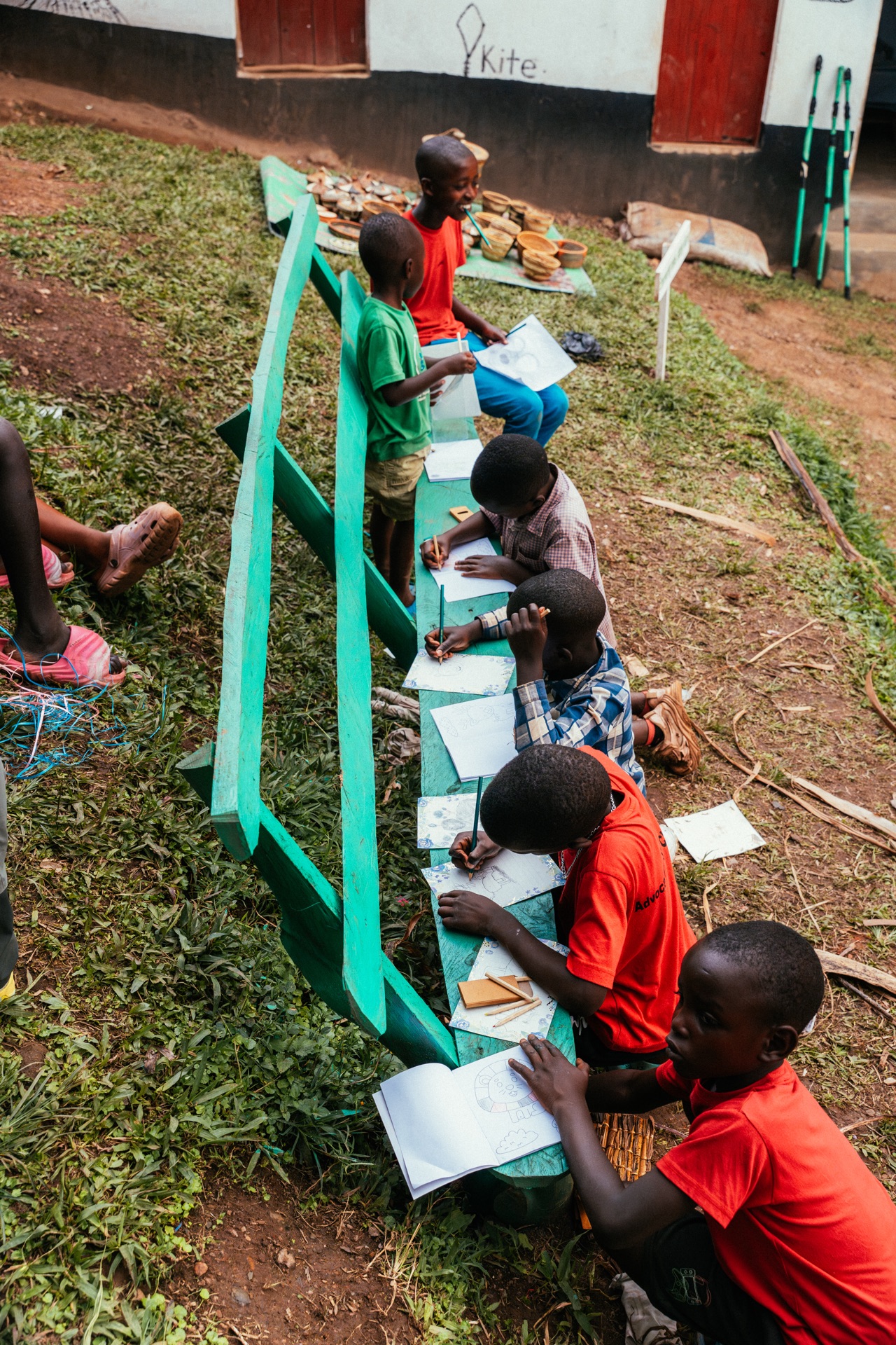 Children writing in notebooks during homework support