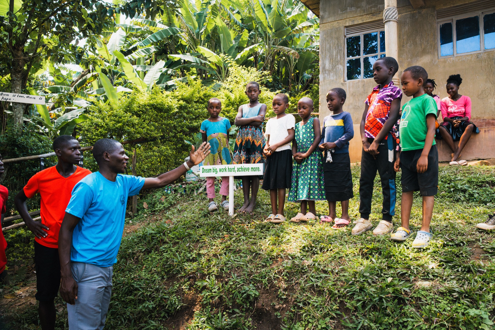 Mark speaking to a group of children